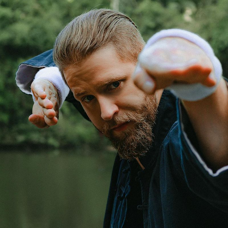 Close-up on a person's focused expression during exercise.